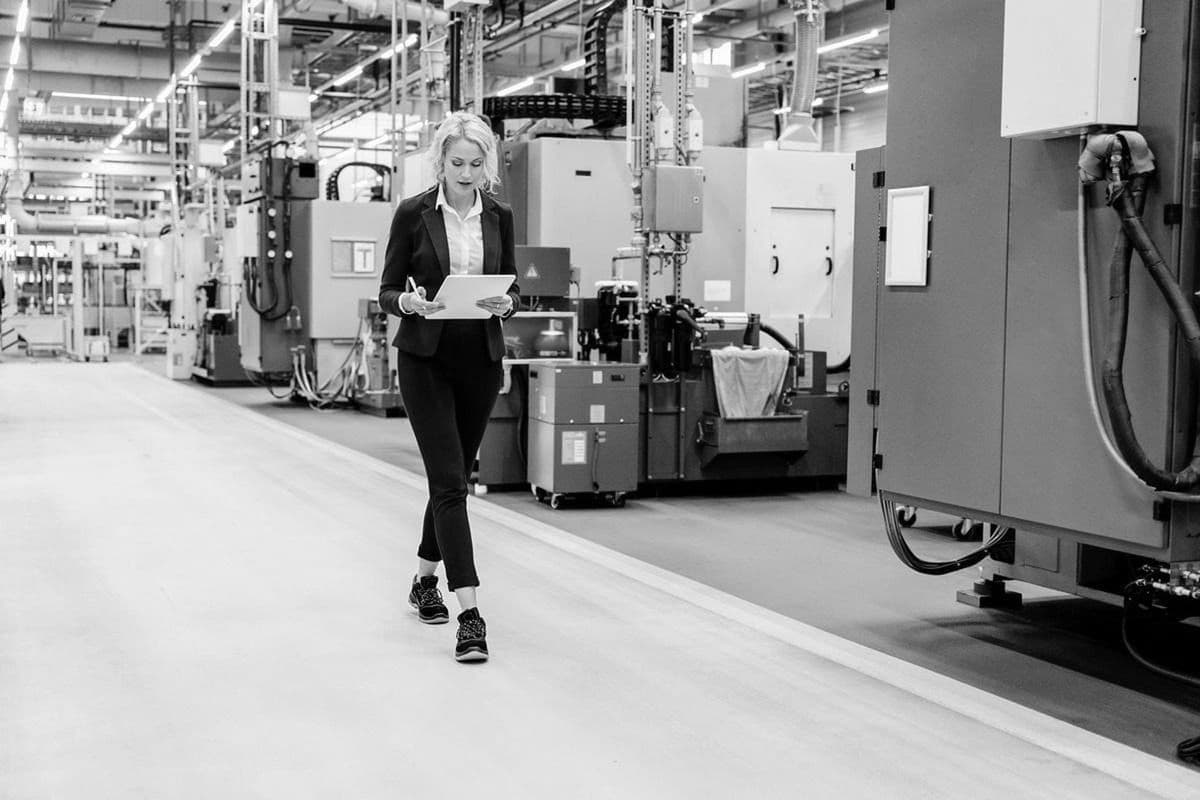 Manufacturing leader reviewing plant operations